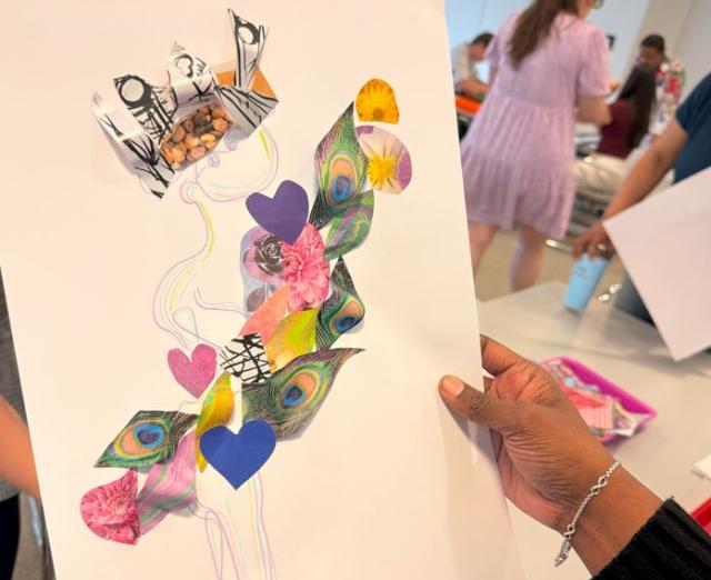 Someone holding up a collage artwork created during Pew workshop